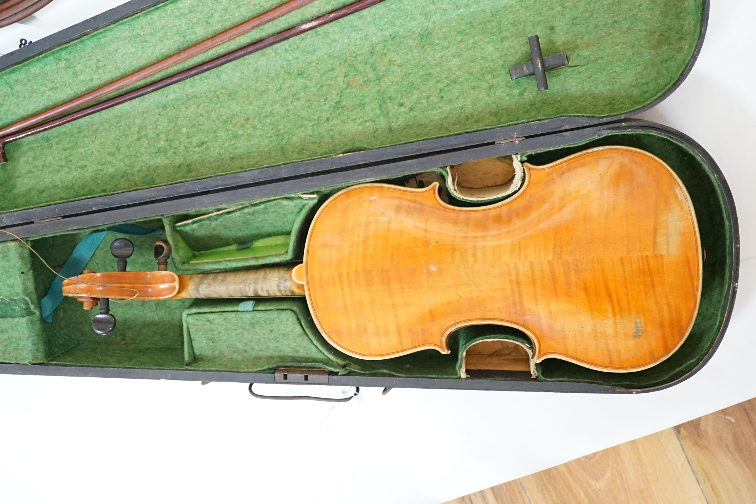 A 19th century 3/4 size violin, cased with 2 bows and 1 other German violin